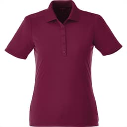 A women's short sleeve polo shirt in a rich burgundy colour, featuring a collar and button detailing. It has a logo.