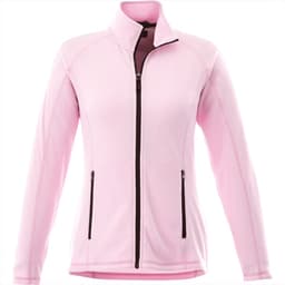 A women's polar fleece jacket in soft pink, featuring a full zip and two front pockets. It has a logo on the chest.