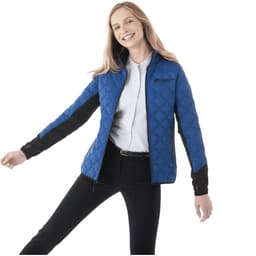 A blue and black insulated jacket designed for women, featuring a logo on the chest and a patterned exterior.