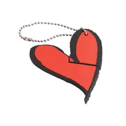 A red heart-shaped USB flash drive with a black outline, attached to a silver ball chain.