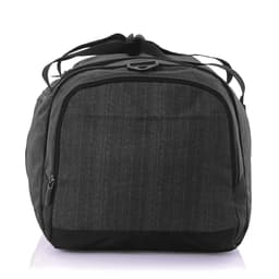 A grey duffle bag with a zippered main compartment and dual carrying straps, featuring branding on the exterior.