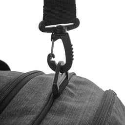 A close-up of a black duffle bag strap featuring a clip attachment and zipper detail.