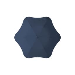 A navy BLUNT Metro Umbrella with a unique octagonal shape and a central button, featuring a logo.