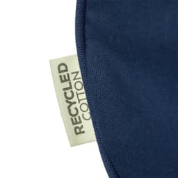 A close-up of a navy fabric featuring a label that reads "Recycled Cotton".