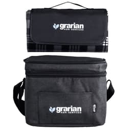 A black and grey cooler bag with a matching picnic blanket on top, featuring a logo.