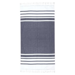 A Turkish beach towel in navy and white with decorative stripes and tassels along the edges.