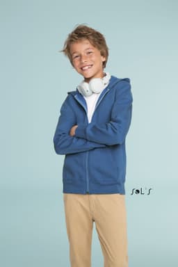 A blue hoodie made of 50% cotton and 50% polyester, featuring a front zip and a logo. A child is wearing headphones.