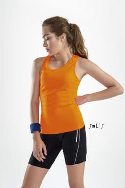 A sporty women's singlet in vibrant orange, made from 100% breathable polyester, paired with black shorts and an accessory.