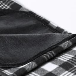 A blanket featuring a black and white checkered pattern, with a soft texture and neatly stitched edges.