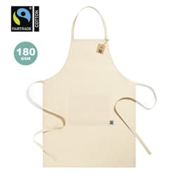 A cream-coloured cotton apron with a front pocket and ties, featuring a logo and a Fairtrade tag.