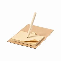 A notepad with yellow pages and a wooden pencil placed on a brown cover. The pencil is poised above the pages.