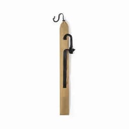 A wooden tool with a pointed end, featuring a black strap and hook at the top.