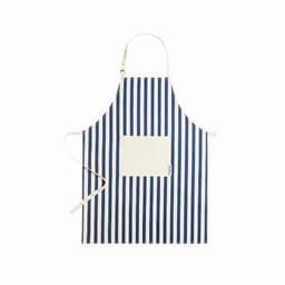 A striped apron in navy blue and cream featuring a front pocket and adjustable neck strap.