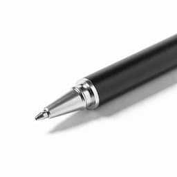 A black pen with a silver tip sits on a plain background, showcasing a sleek, modern design.