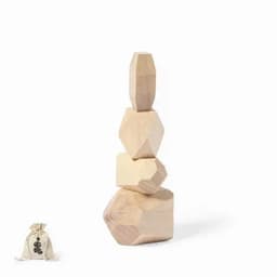 A stack of wooden geometric shapes in natural tones, alongside a small bag.