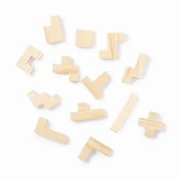 A collection of wooden puzzle pieces in various shapes, arranged haphazardly on a white background.