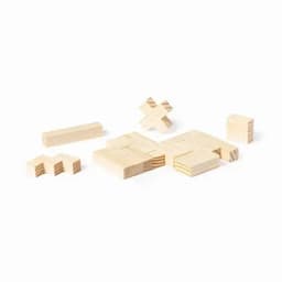 A set of light wooden building blocks in various shapes and sizes, arranged on a flat surface.