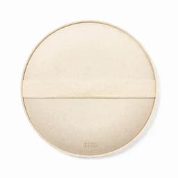 A round, beige plate made from wheat straw material, featuring a textured band for an eco-friendly design.