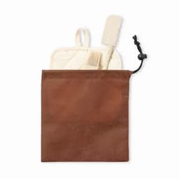 A brown pouch containing a grooming kit with a comb and a small brush. The pouch has a drawstring closure.