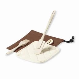 A baking set featuring a cream-coloured spatula, a small brush, and a brown storage pouch.