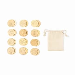 A set of circular wooden tokens with various designs, accompanied by a small beige drawstring storage bag.