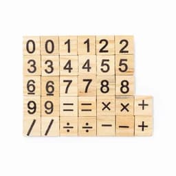 A set of wooden blocks featuring printed numbers and mathematical symbols in black on a natural wood background.