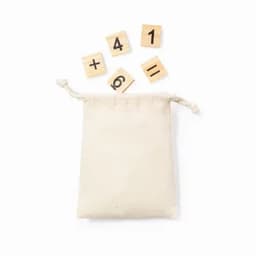 A cream drawstring bag with wooden tiles featuring numbers and symbols.
