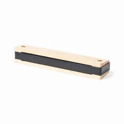 A wooden magnetic knife strip in natural wood with a black magnetic band. Includes mounting holes for installation.