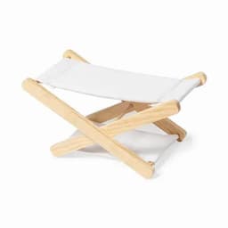 A footrest featuring a white fabric cover and a natural wooden frame, designed for comfortable seating.