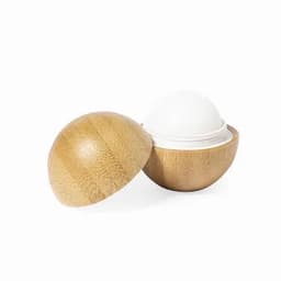 A bamboo container with a rounded lid, housing a white solid product inside. The wood has a natural texture.