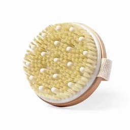 A round body brush with soft bristles and a wooden base, featuring a fabric strap for easy handling.
