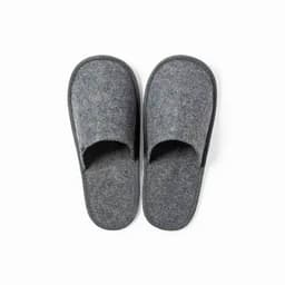 A pair of grey felt slippers with an open toe design and a soft sole.