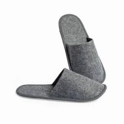 A pair of grey felt slippers with open toes and a plush texture. They have a simple design and soft soles.