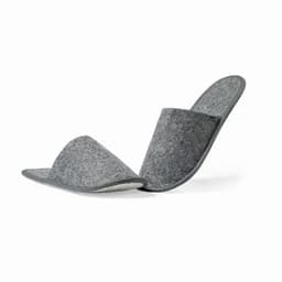 A pair of grey felt slippers with a soft lining, featuring a slip-on design and rounded toes.