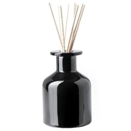 A black ceramic diffuser bottle with wooden reeds protruding from the top. It has a glossy finish and a simple design.