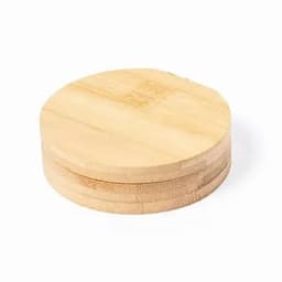 A round bamboo coaster with a smooth surface, showcasing its natural light brown colour and wooden texture.