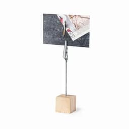 A card holder featuring a wooden base and a metal clip for holding notes or photos.