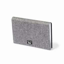 A grey notebook with a textured cover, featuring a small logo on the front.