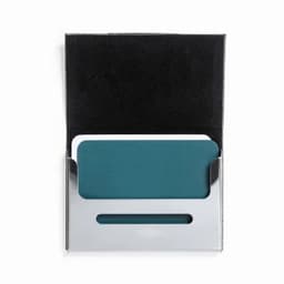 A card holder with a teal card and a silver metallic case, presented in a black box.