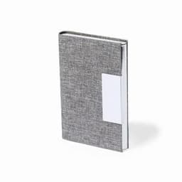 A grey notebook with a textured cover and a white label area on the front. It has a textured finish.