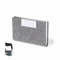 A grey business card holder with a textured fabric design and a sleek, minimalistic look. It includes a stand for display.