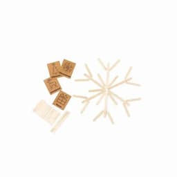 A set of wooden craft sticks arranged in a snowflake pattern, with decorated square cards nearby.
