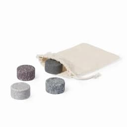 A set of four drink chillers in various shades, accompanied by a natural fabric pouch for storage.