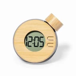 A round digital clock with a wooden finish, featuring a green display showing the time as 12:05 and a raised dial.