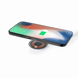 A smartphone with a wireless charging pad, displaying a battery icon and a green charge level. The phone is black.