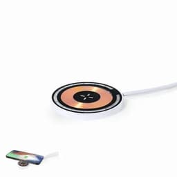 A wireless charging pad in a circular design with a white and copper colour scheme, connected by a cable.