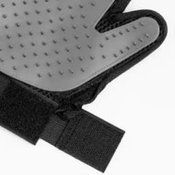 A pair of grey training gloves featuring textured grips and a black Velcro strap for secure fitting.