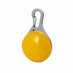 A yellow spherical buoy with a metal clip attached. It has a smooth, shiny surface.