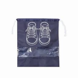A drawstring shoe bag in navy blue featuring a white shoe print design and a transparent panel.