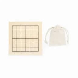 A Sudoku game mat in a cream colour with a grid pattern, accompanied by a small beige drawstring bag.
